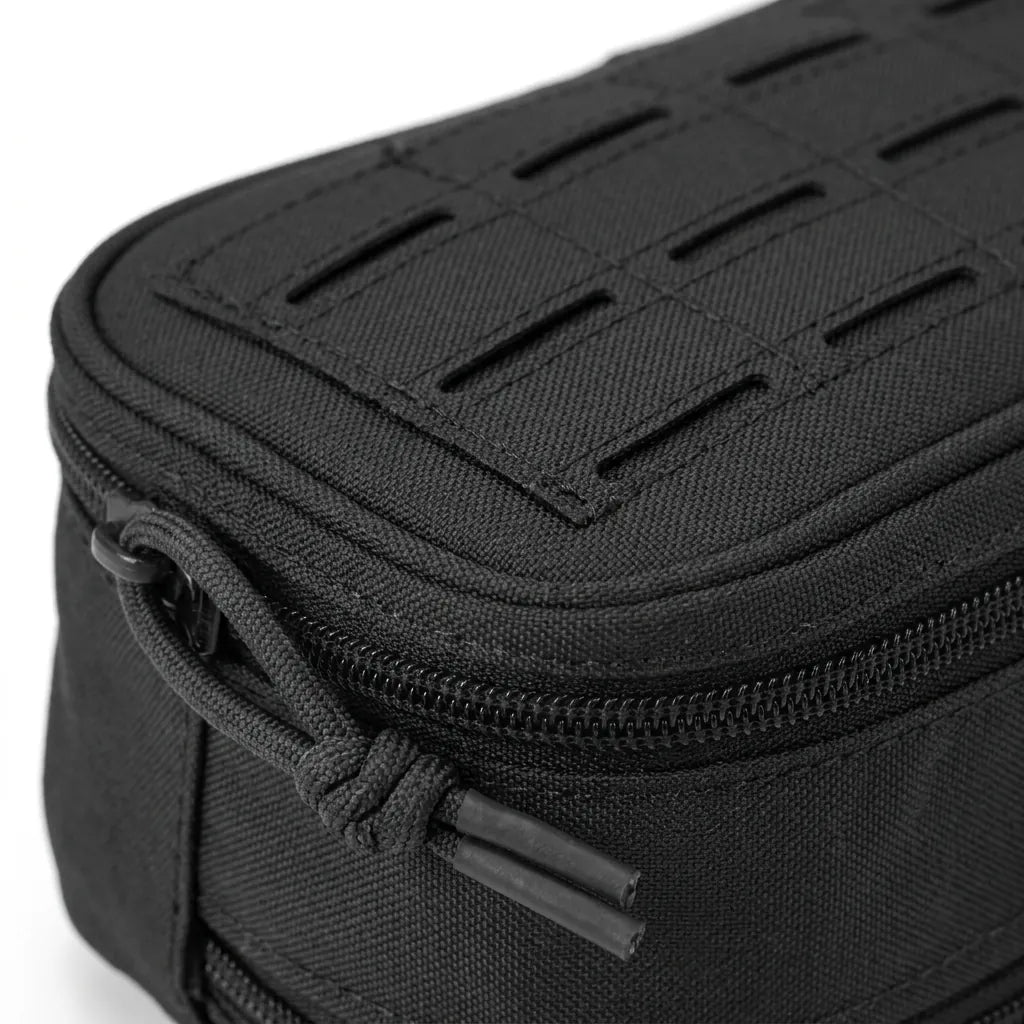 Close up of the laser cut MOLLE panel and zip pull